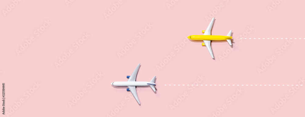 Flights booking and reservation theme with two miniature airplanes