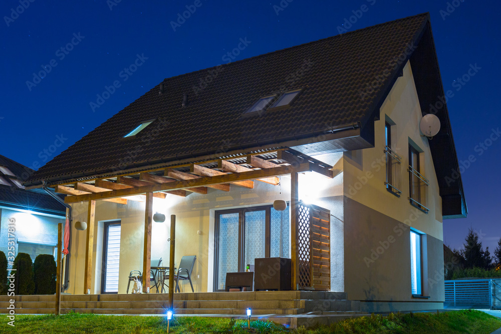 Single-family house in the night scenery, Poland