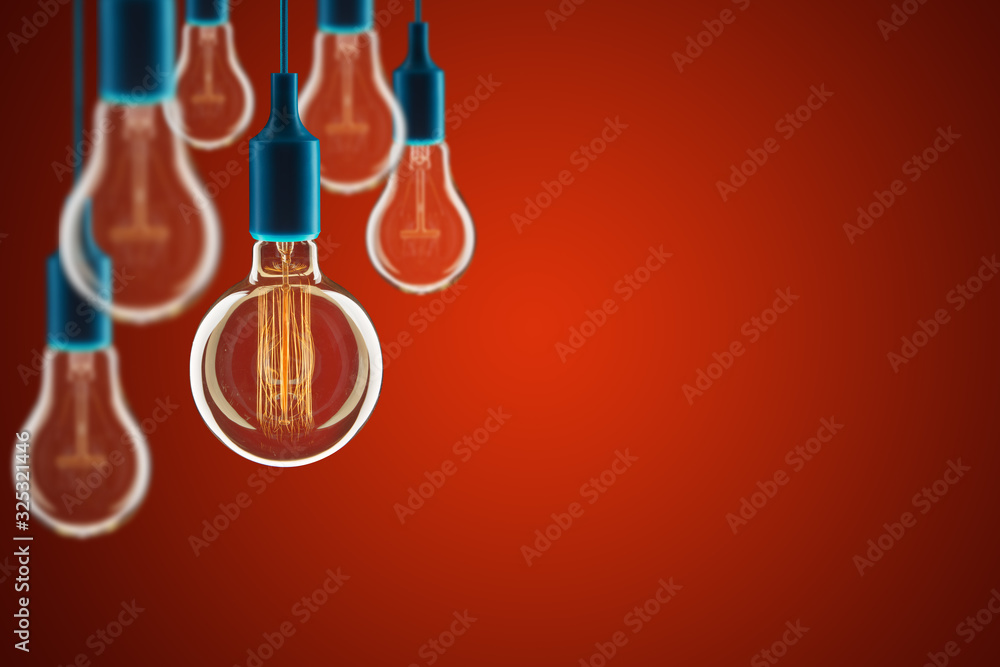 Idea and leadership concept - bulbs on the red background