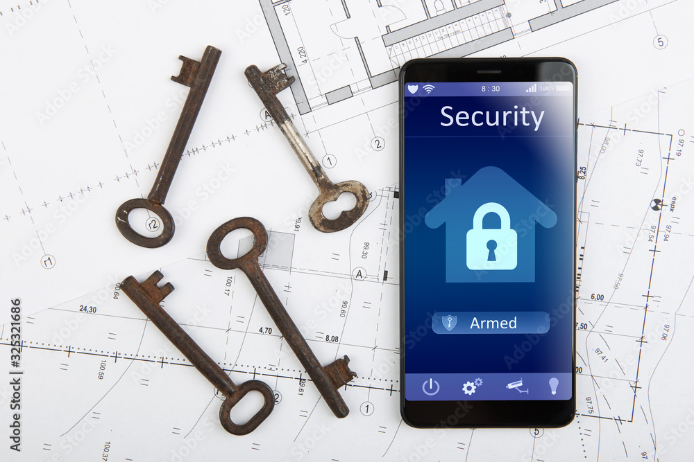 Home security concept smartphone with smart home app and surveillance cctv camera on the desk