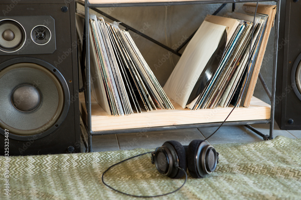 HiFi system with turntable, amplifier, headphones and lp vinyl records in a listening room