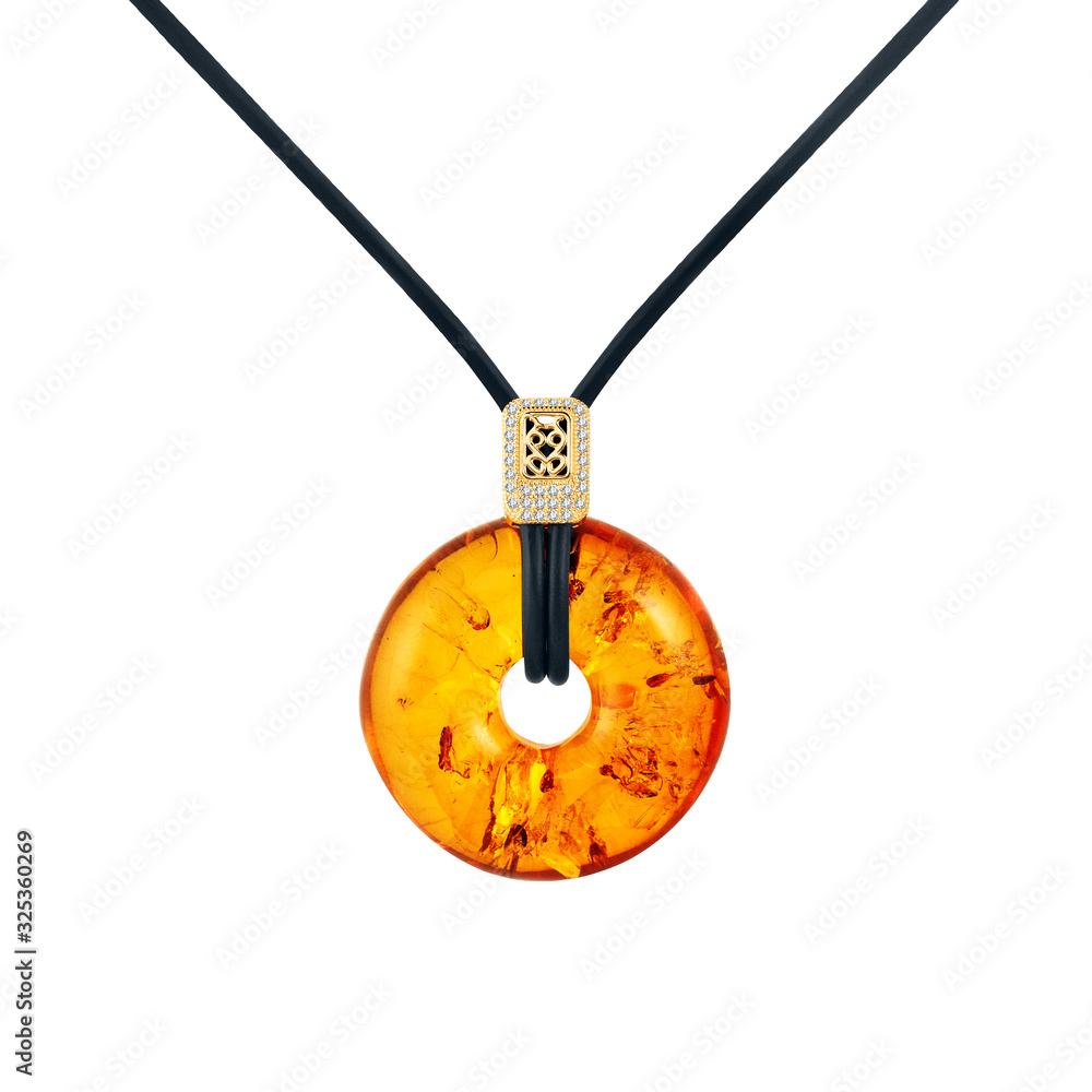 Amber Pendant with gold with Diamonds on a leather cord (isolated from white background). Beautiful 