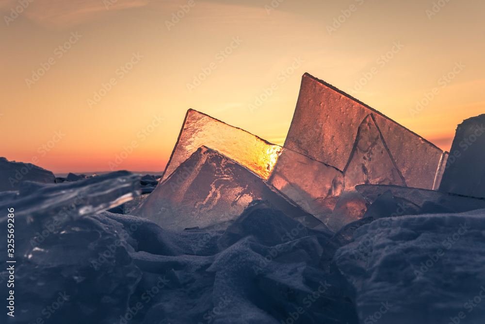 Curious yet beautiful ice formations on lake ice at sunrise. Lake Baikal, Siberia, Russia.