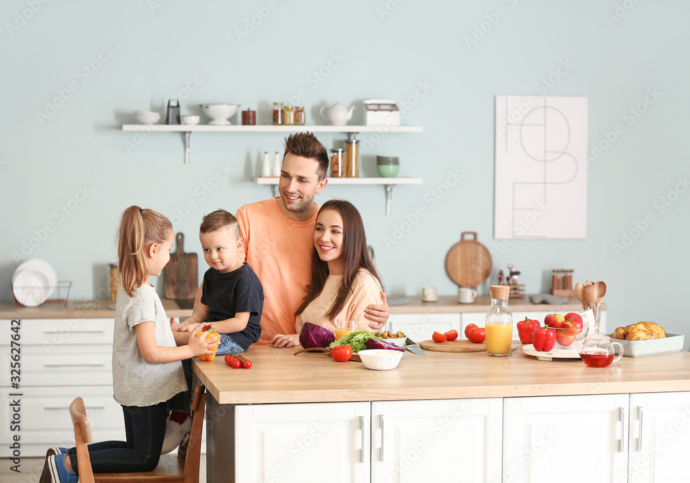 Young family cooking together in kitchen