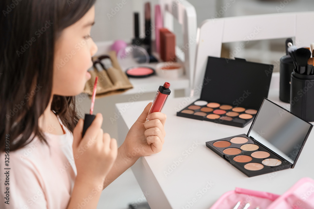 Cute little makeup artist at home