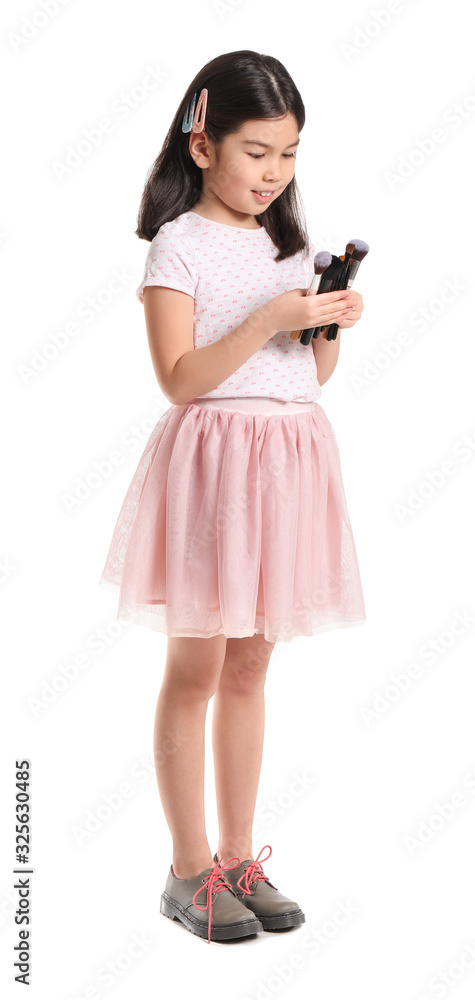 Cute little makeup artist on white background