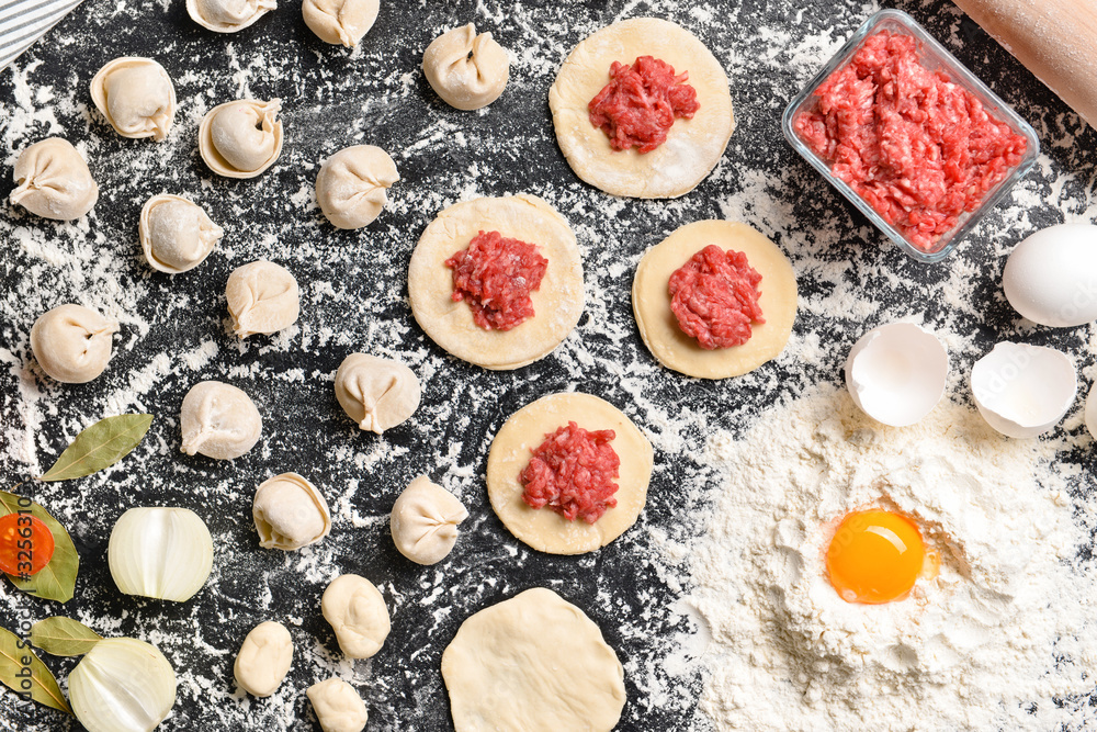 Making of tasty dumplings on dark background