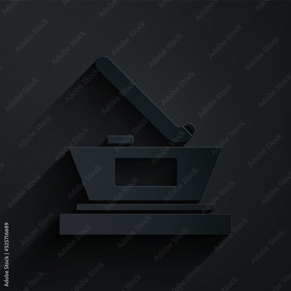 Paper cut Ice hockey cup champion icon isolated on black background. Hockey trophy. Paper art style.