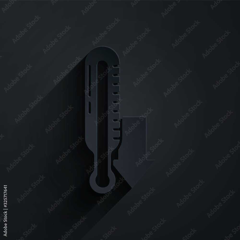 Paper cut Meteorology thermometer measuring icon isolated on black background. Thermometer equipment