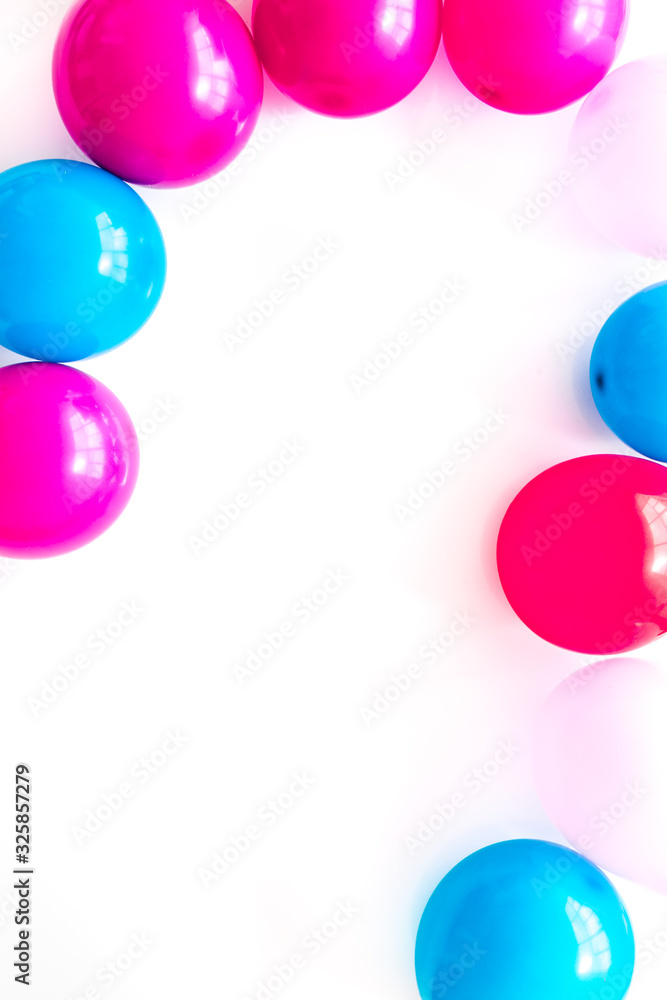 Colorful balloons frame on white background top-down frame copy space