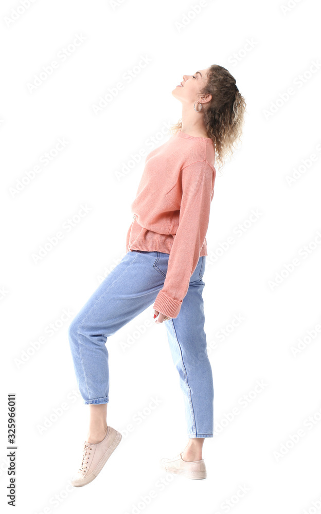 Beautiful young woman in warm sweater on white background