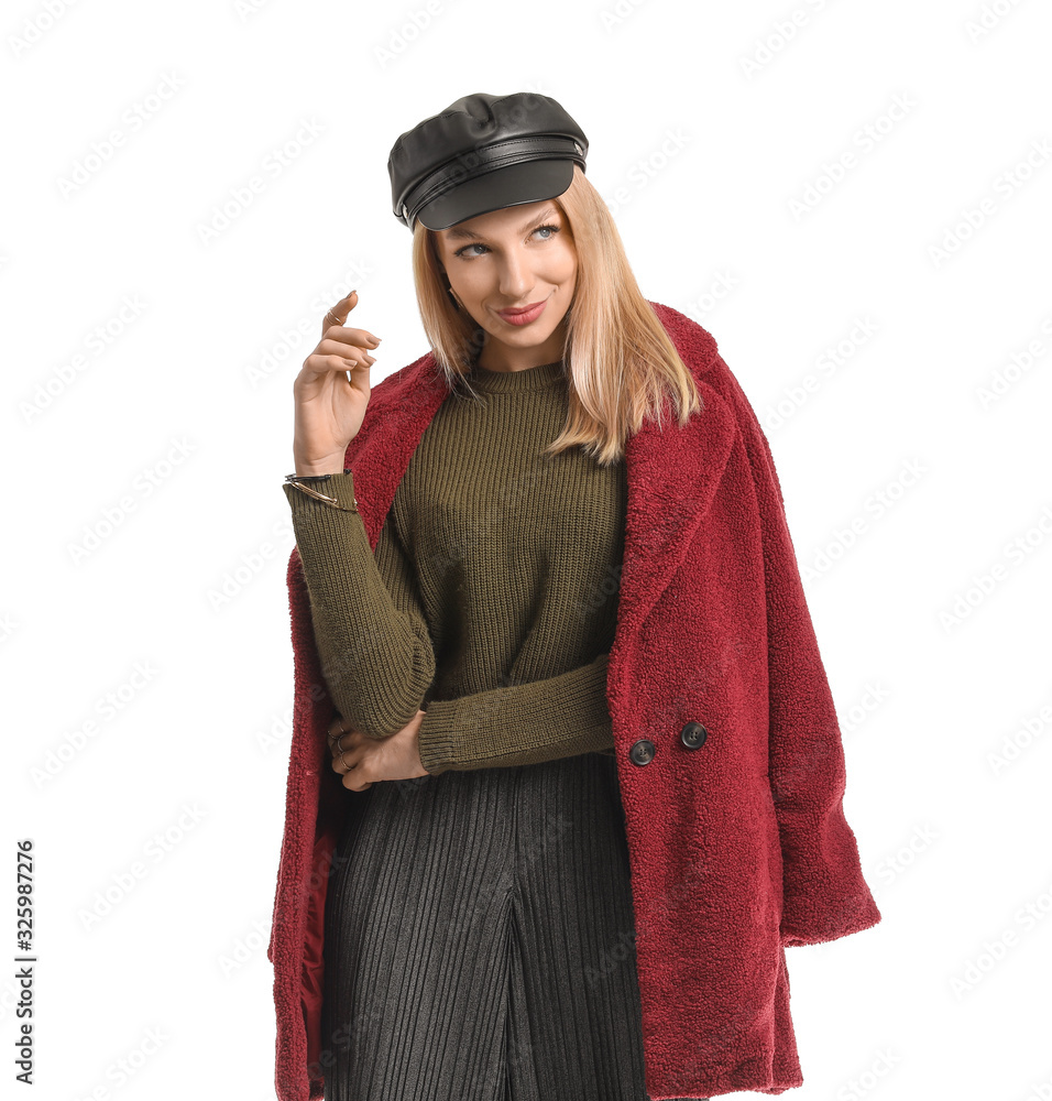 Young woman in warm sweater on white background