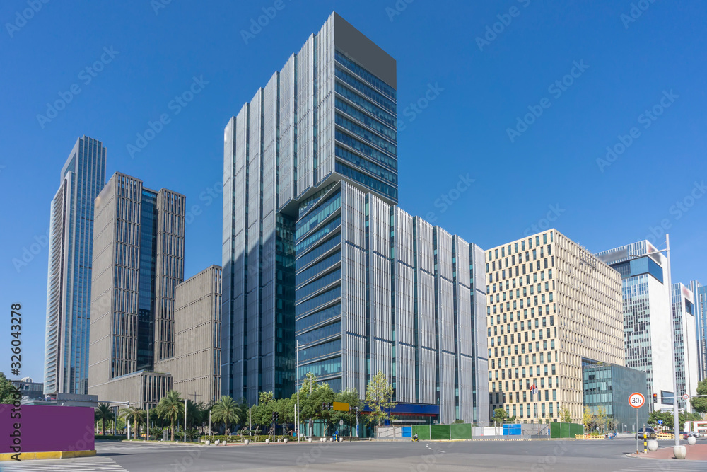 Urban road and modern office building of Ningbo business district