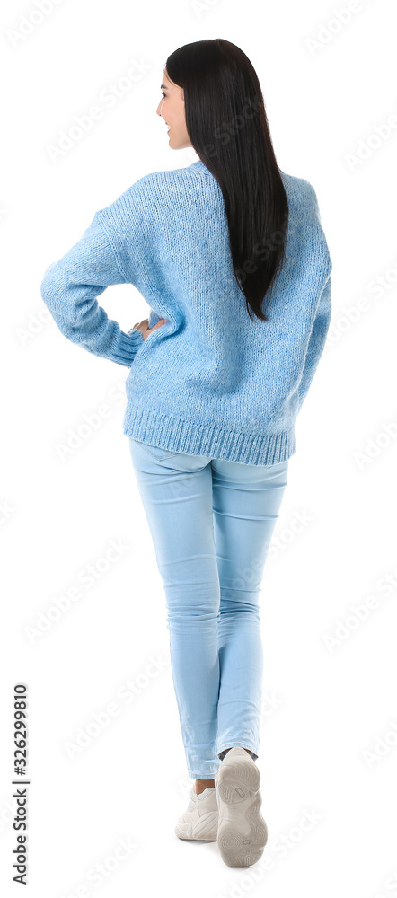 Beautiful young woman in warm sweater on white background, back view