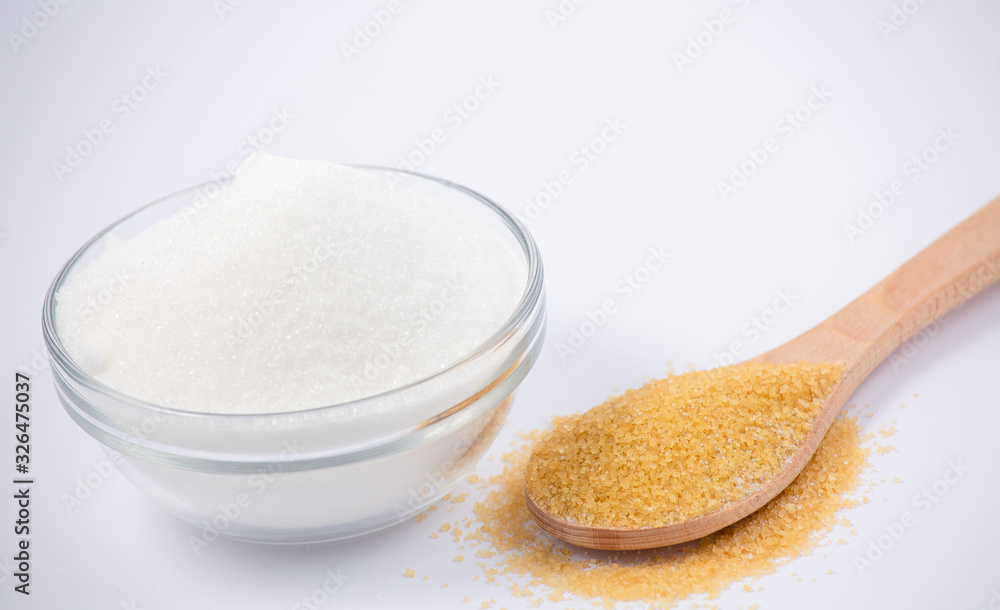 Brown sugar in a round glass cup on a white background, healthy sugar. Used for cooking or desserts.