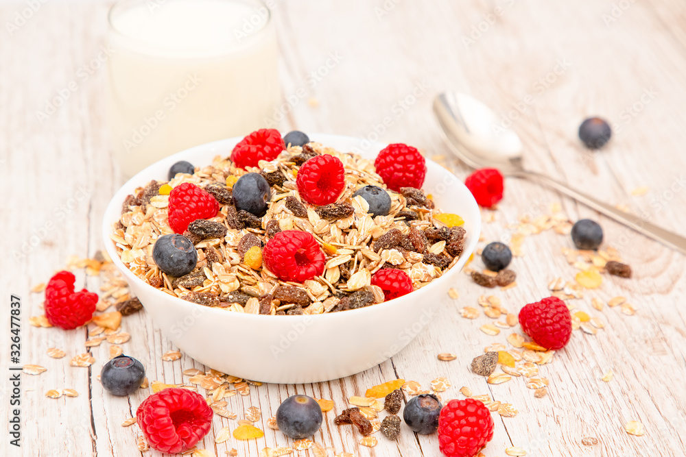 Breakfast Served in the morning with corn flakes Whole grains and raisins with milk in cups and Stra