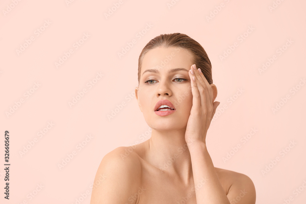 Beautiful young woman on color background. Concept of plastic surgery