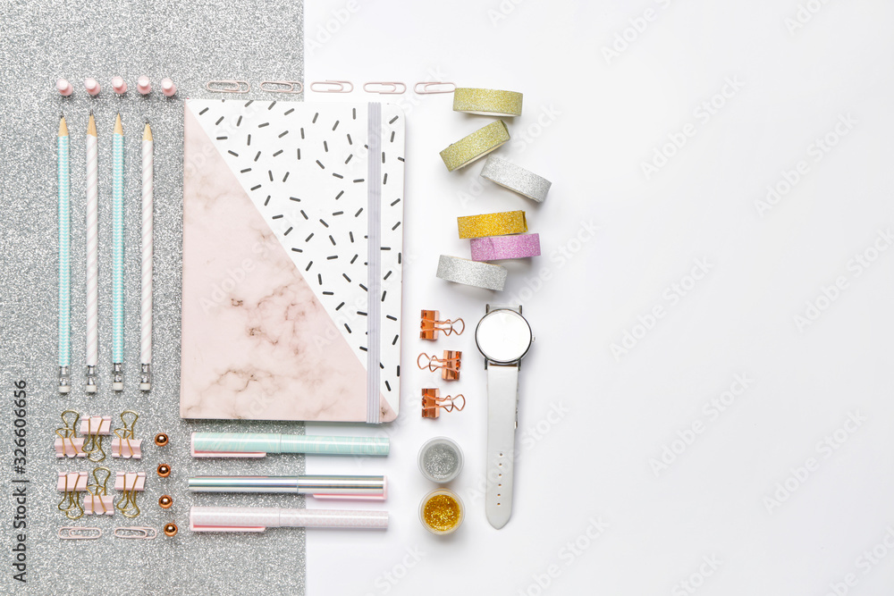 Set of school supplies with clock on white background