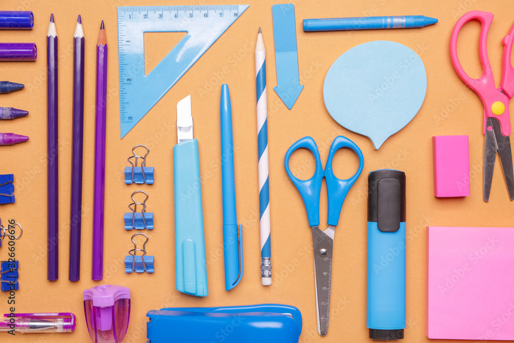 Set of school supplies on color background