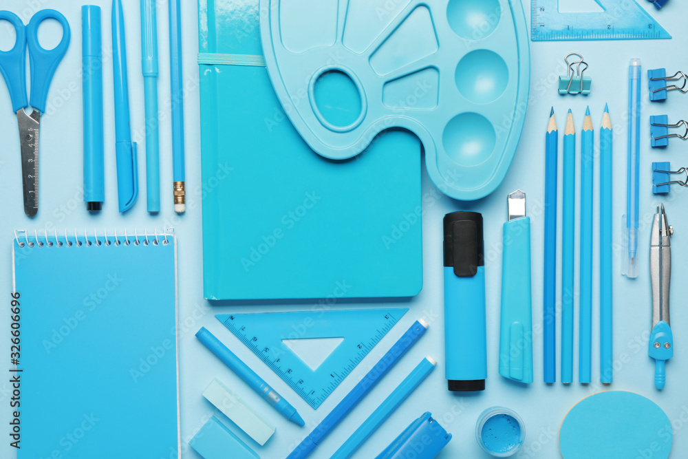 Set of school supplies on color background