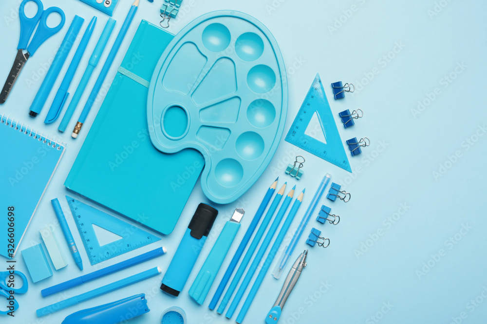 Set of school supplies on color background