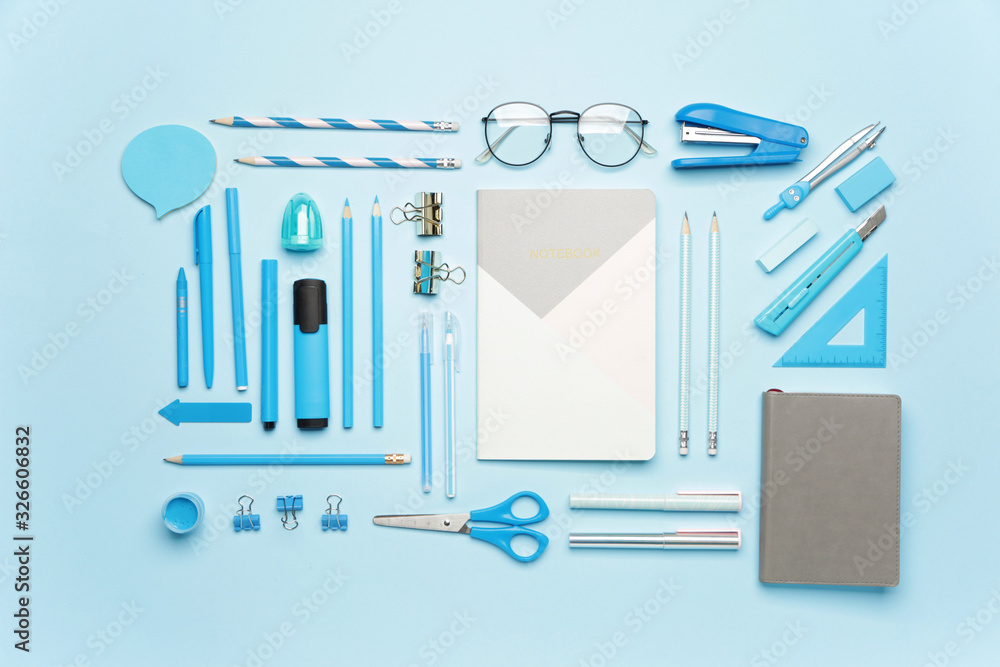 Set of school supplies on color background