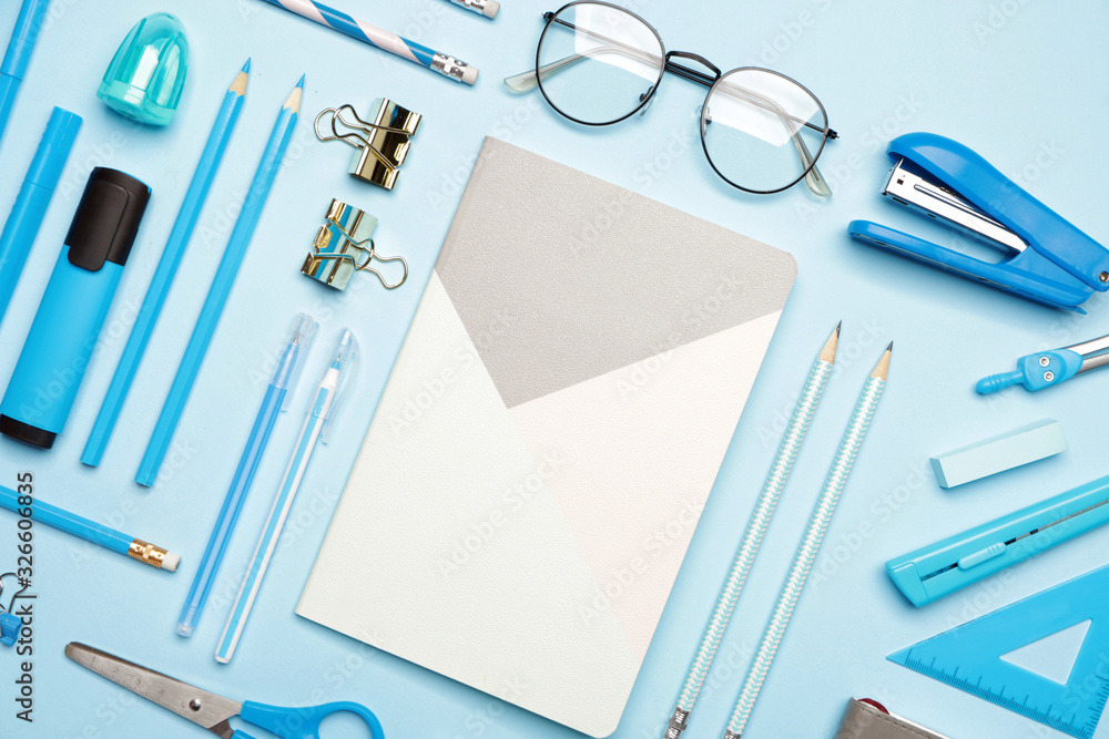 Set of school supplies on color background