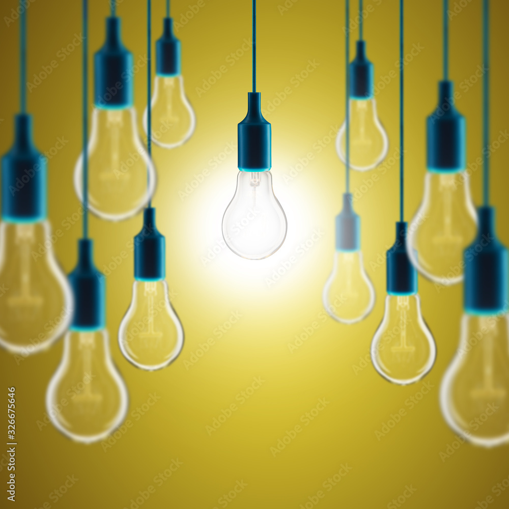 Idea and leadership concept - bulbs on the yellow background