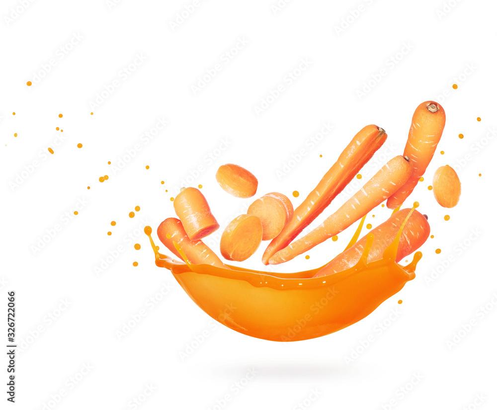 Whole and sliced carrots with splash of fresh juice on a white background