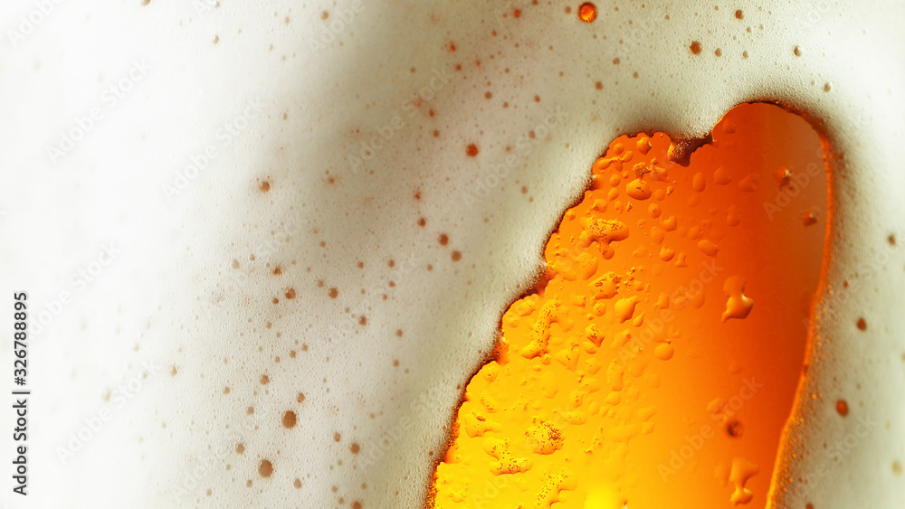 Detail of beer drink with overflowing foam head