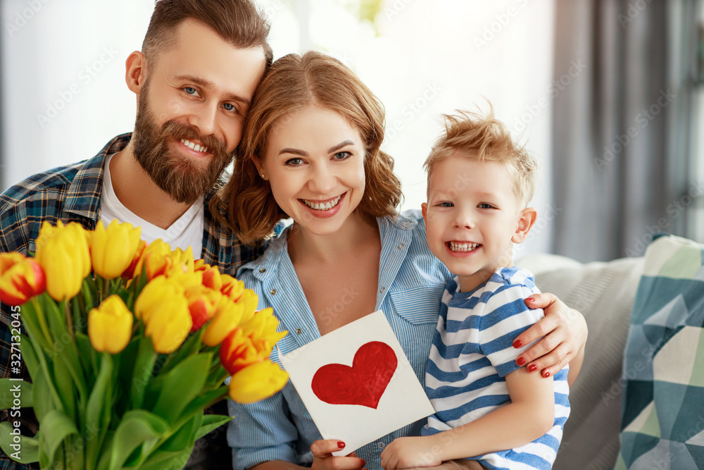 happy mothers day! father and child congratulate mother on holiday  .