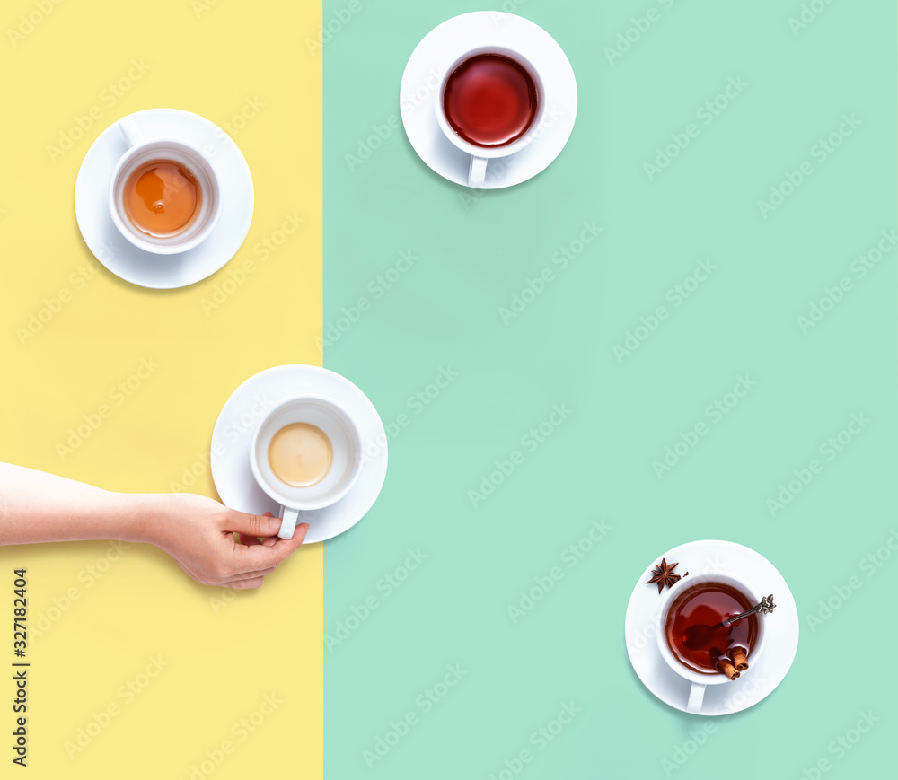 Female hand holding a tea cup overhead view - flat lay