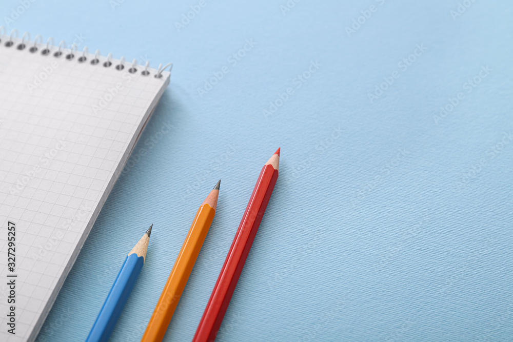 Set of school stationery on color background