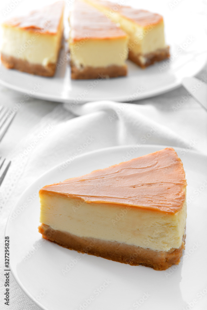 Slice of sweet caramel cheesecake on plate