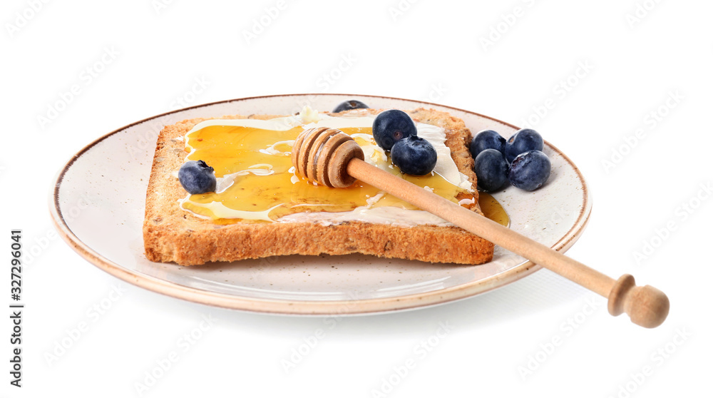 Tasty toasted bread with honey, butter and berries on white background