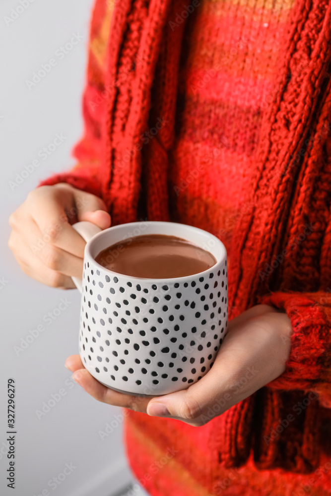 Woman with cup of hot chocolate, closeup