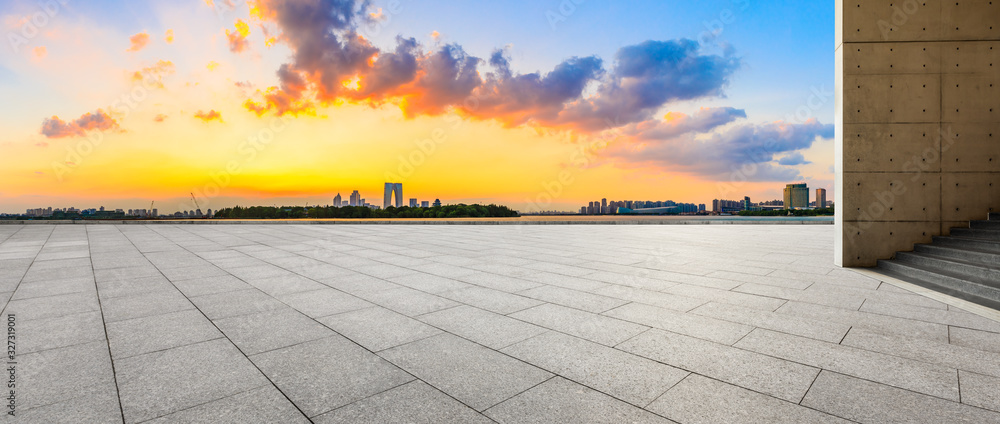 Empty square floor and beautiful city skyline with buildings at sunset in Suzhou,panoramic view.