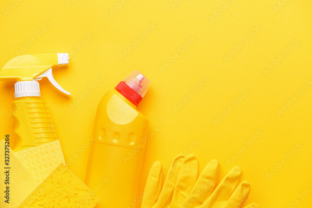 Set of cleaning supplies on color background