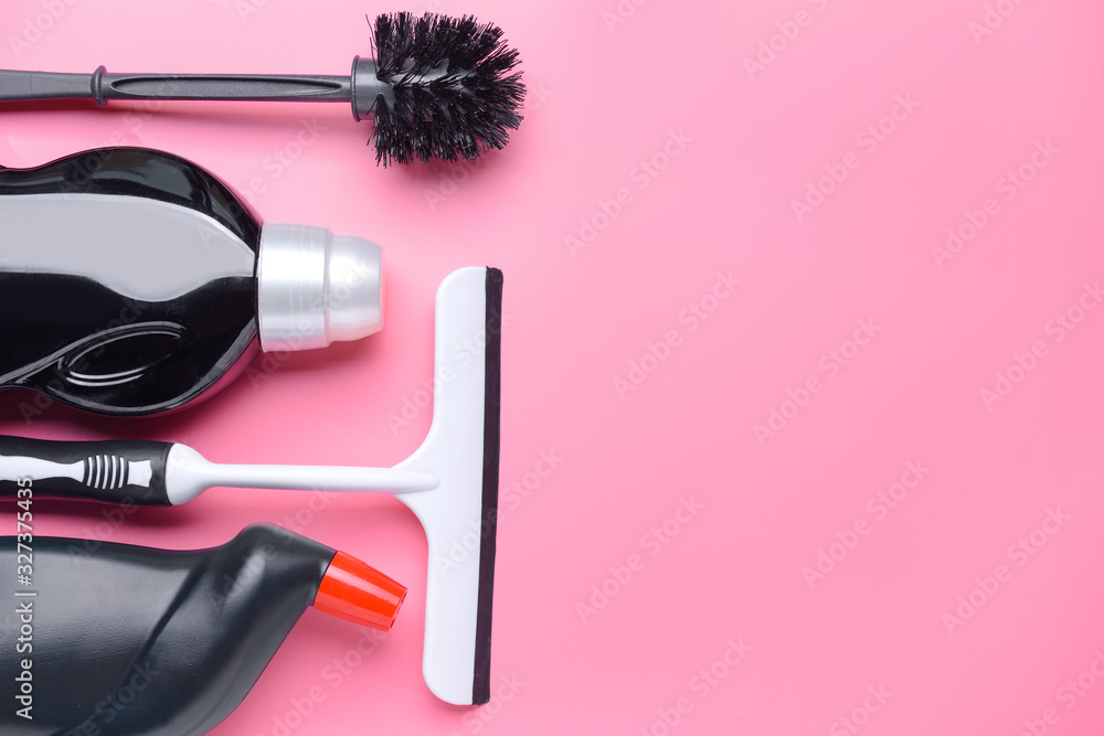 Set of cleaning supplies on color background