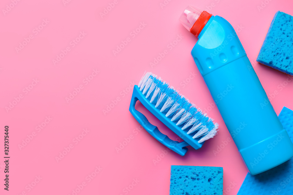 Set of cleaning supplies on color background