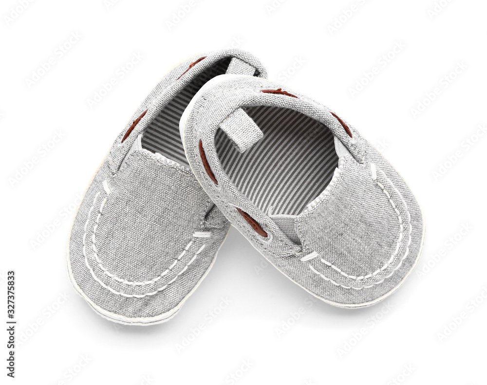 Baby booties on white background