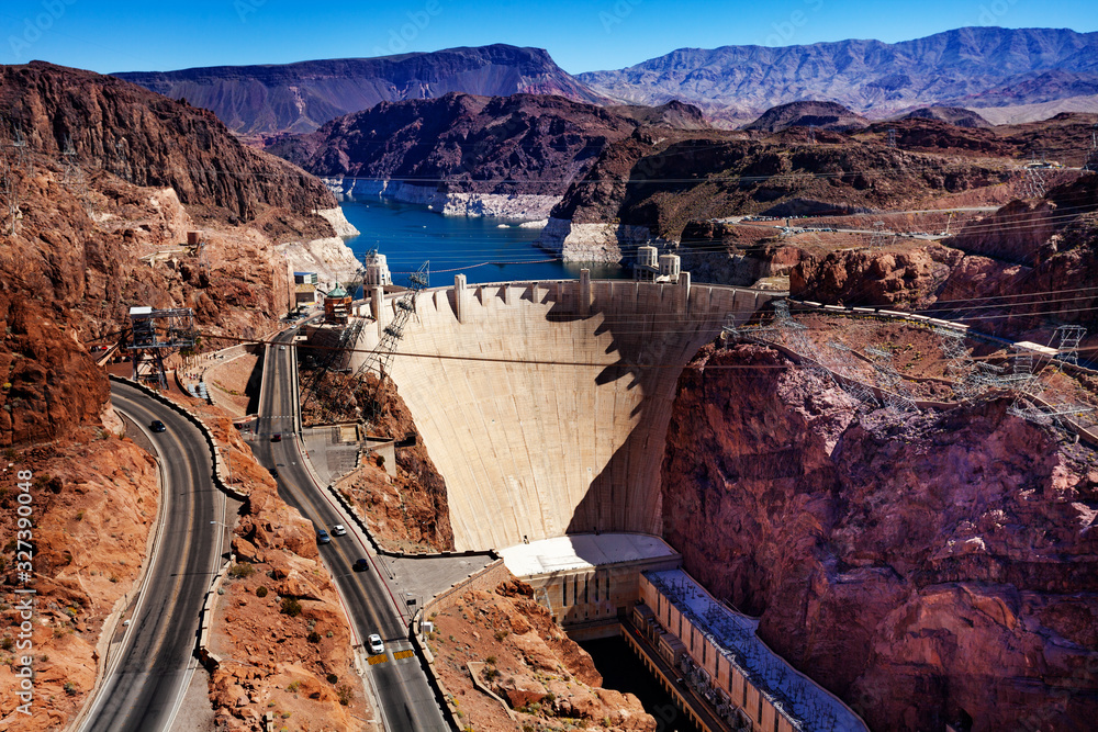 Lake road and concrete arch-gravity Hoover Dam in the Black Canyon of the Colorado river on Nevada A