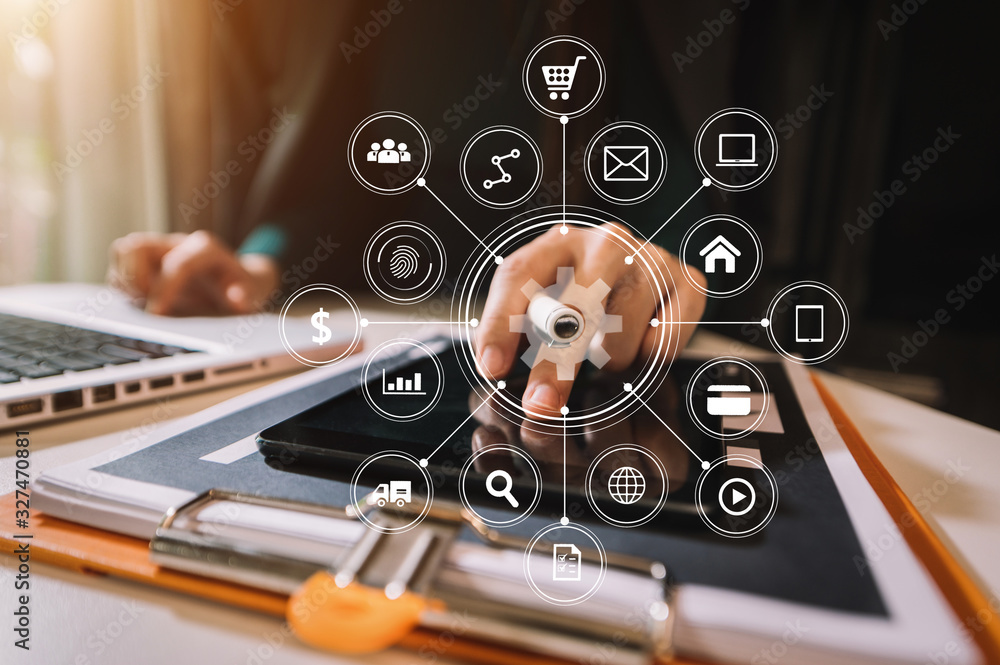 Businessman using mobile phone and laptop computer on white desk big data analytics with business in