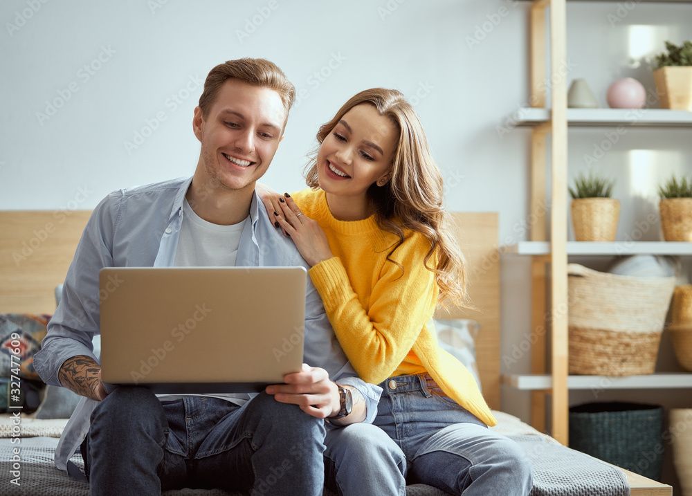 couple is using a laptop