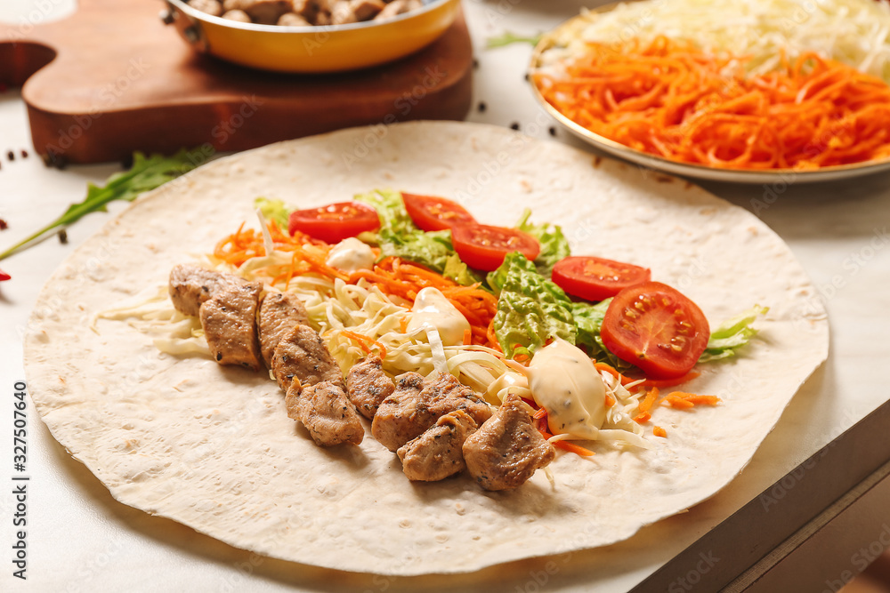 Tasty doner kebab on table