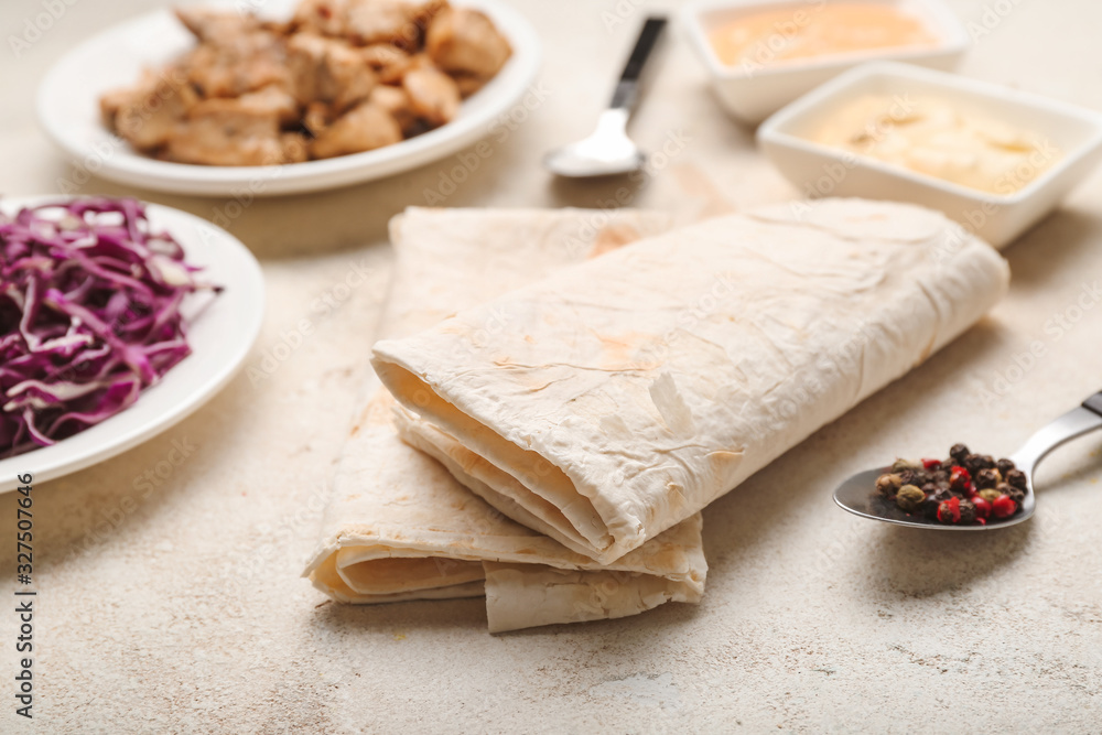 Ingredients for tasty doner kebab on table