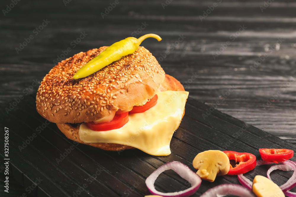 Tasty doner kebab in bun with vegetables on table