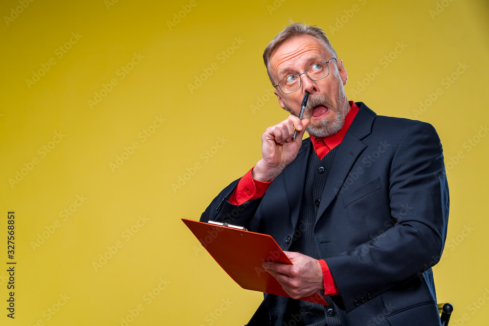 Funny businessman on yellow background. Office worker. Bearded man in formal wear