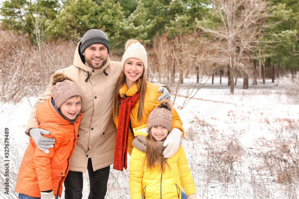 Happy family in park on winter day