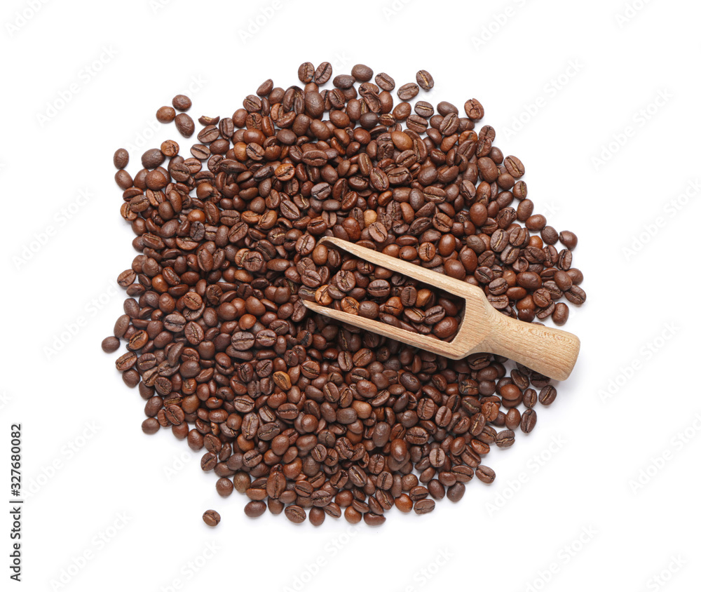 Heap of coffee beans and scoop on white background